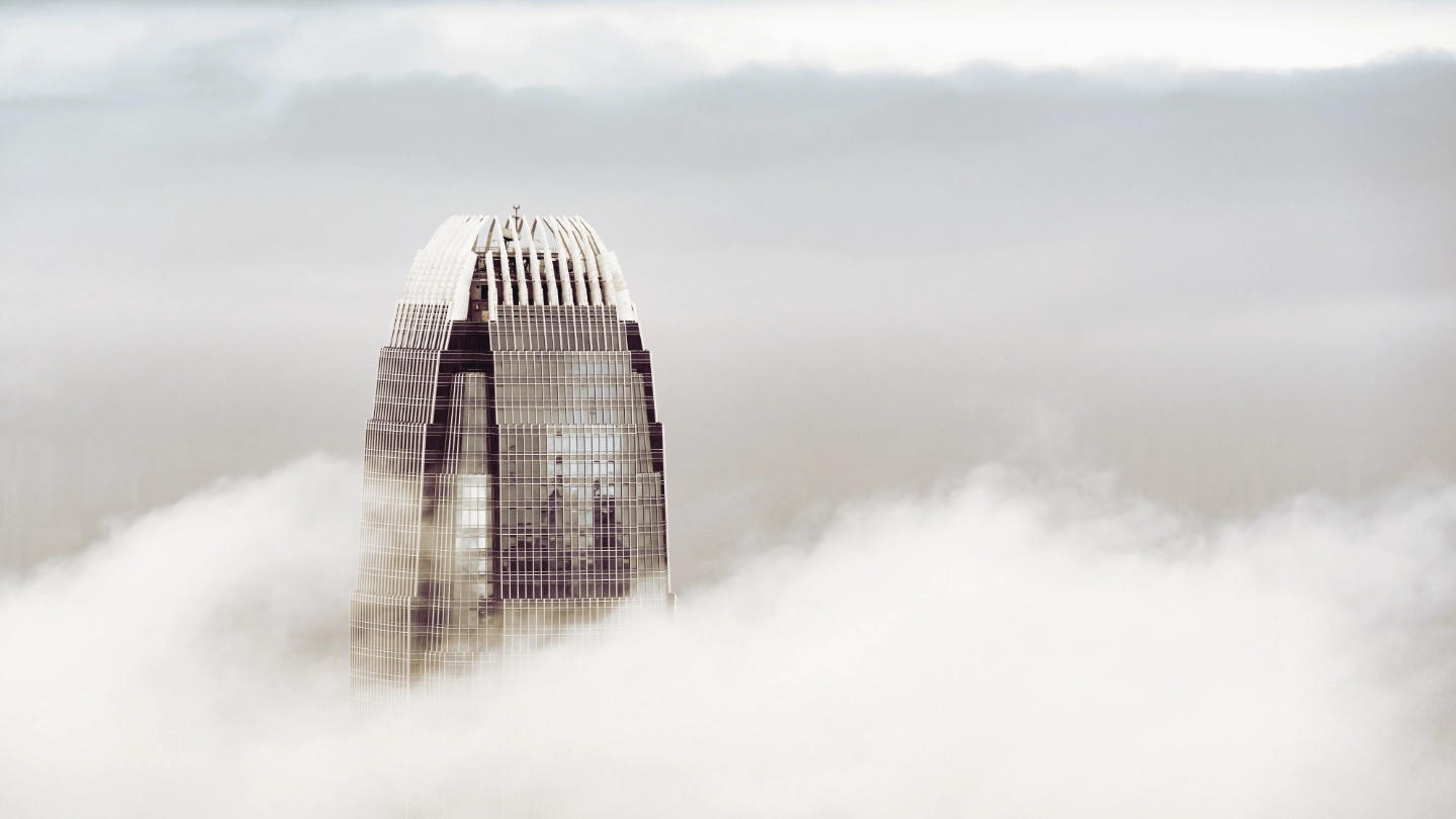 skyscraper in the clouds Skyscrapper building peaking through the clouds