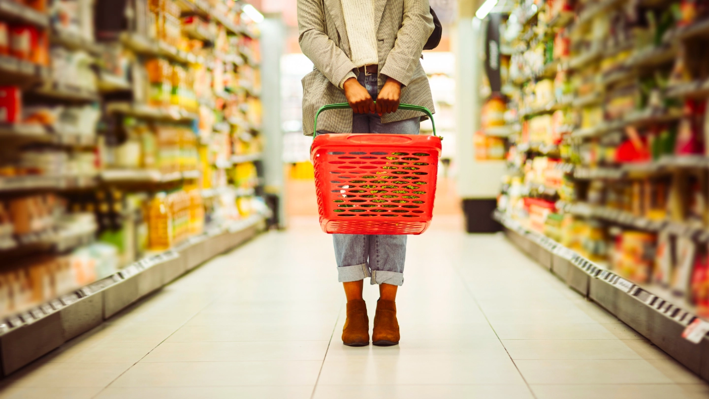 Supermarket shopper with basket Supermarket shopper with basket