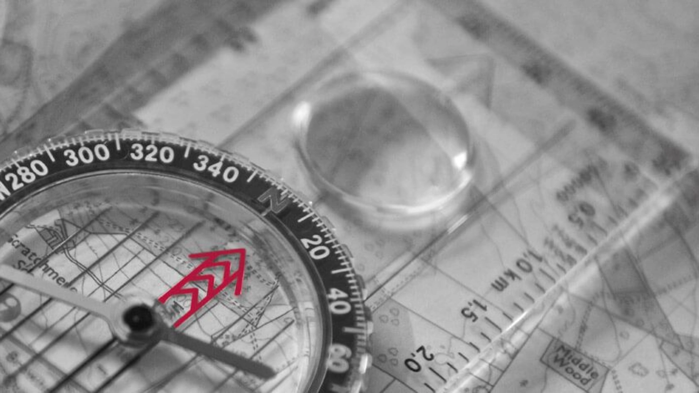 Compass laid over a map | Atradius