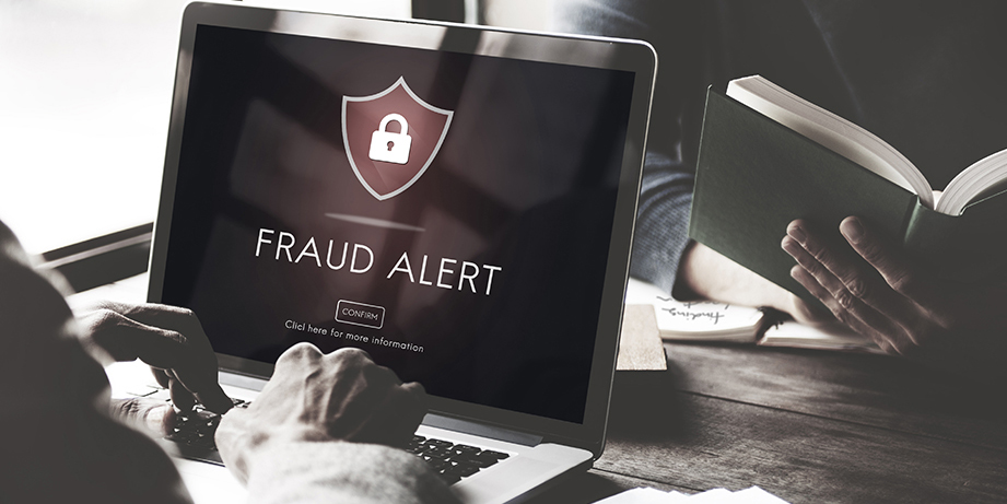 Fraud alert on laptop